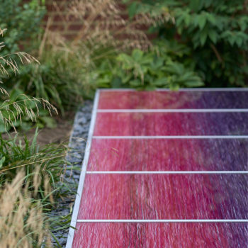 Laura Thomas London garden commission 2019. Loose cotton, lurex, silk and linen threads laminated in uv-stable toughened glass. Photo by Matt Cant.