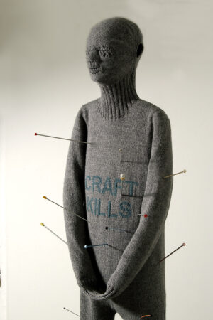 Freddie_Robins,Craft_Kills,2002,2000x680x380mm,machine_knitted_wool,knitting-needles,In_the_collection_of_the_Crafts_Council